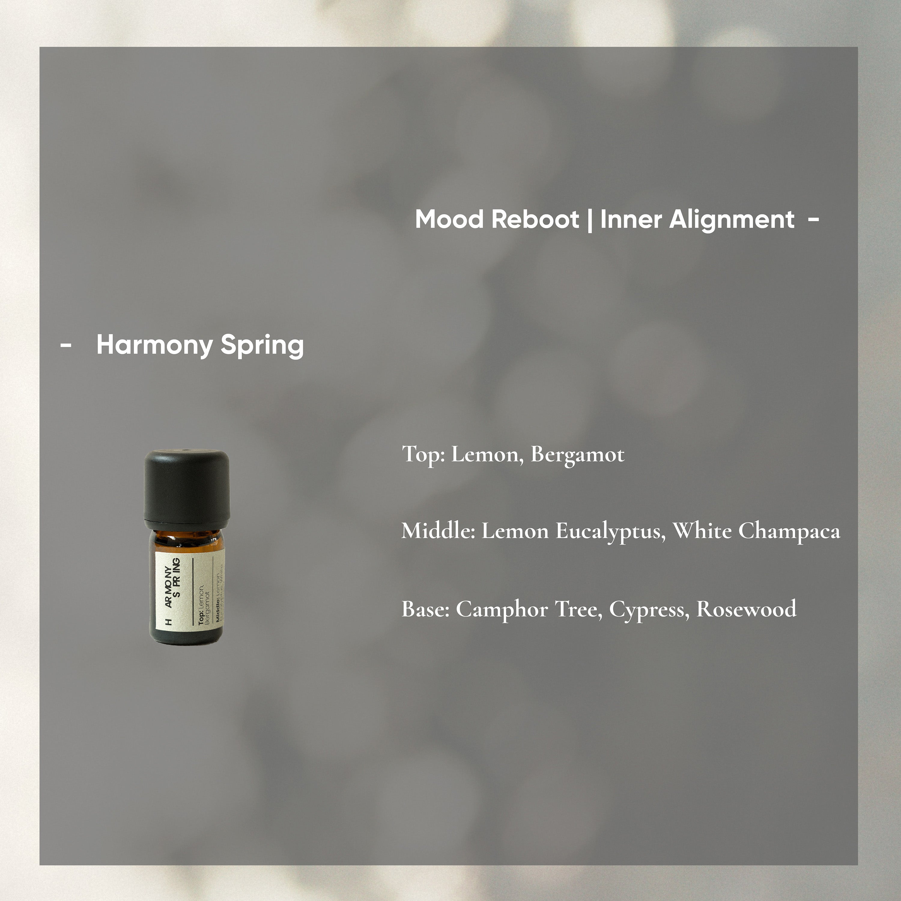 Essential oil bottle with product details on a gray background