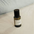 Spray bottle with a black cap on a textured surface