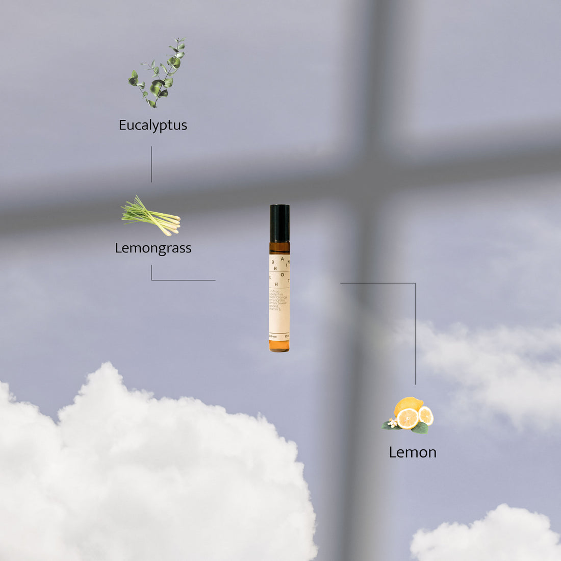 Brain Shot roller bottle displayed against a dreamy sky with clouds, highlighting its key ingredients: eucalyptus, lemongrass, and lemon.