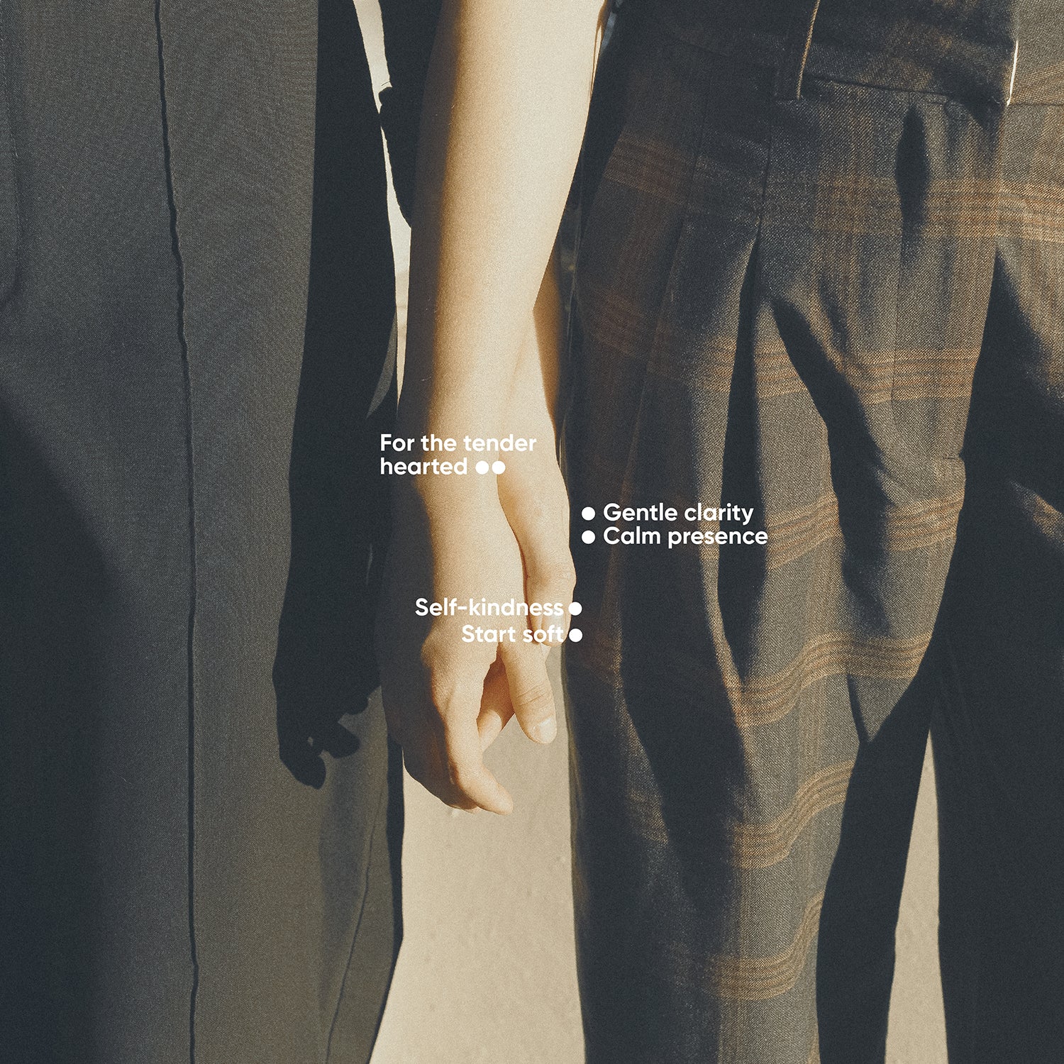 Two people holding hands with text overlay on a blurred background