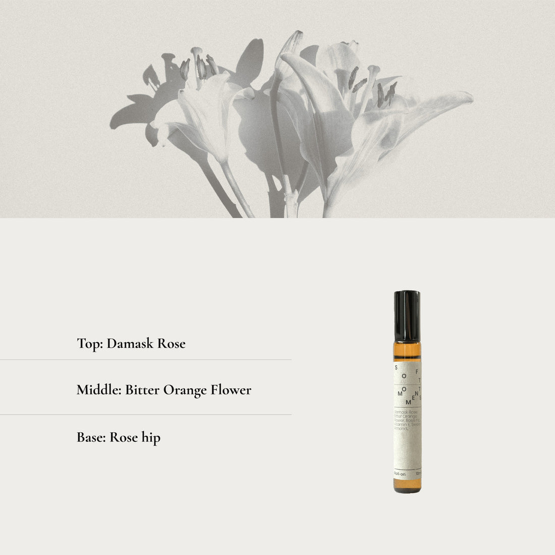 Roll on bottle with floral design and fragrance notes on a light background